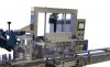 Snap capping machine - tamp style